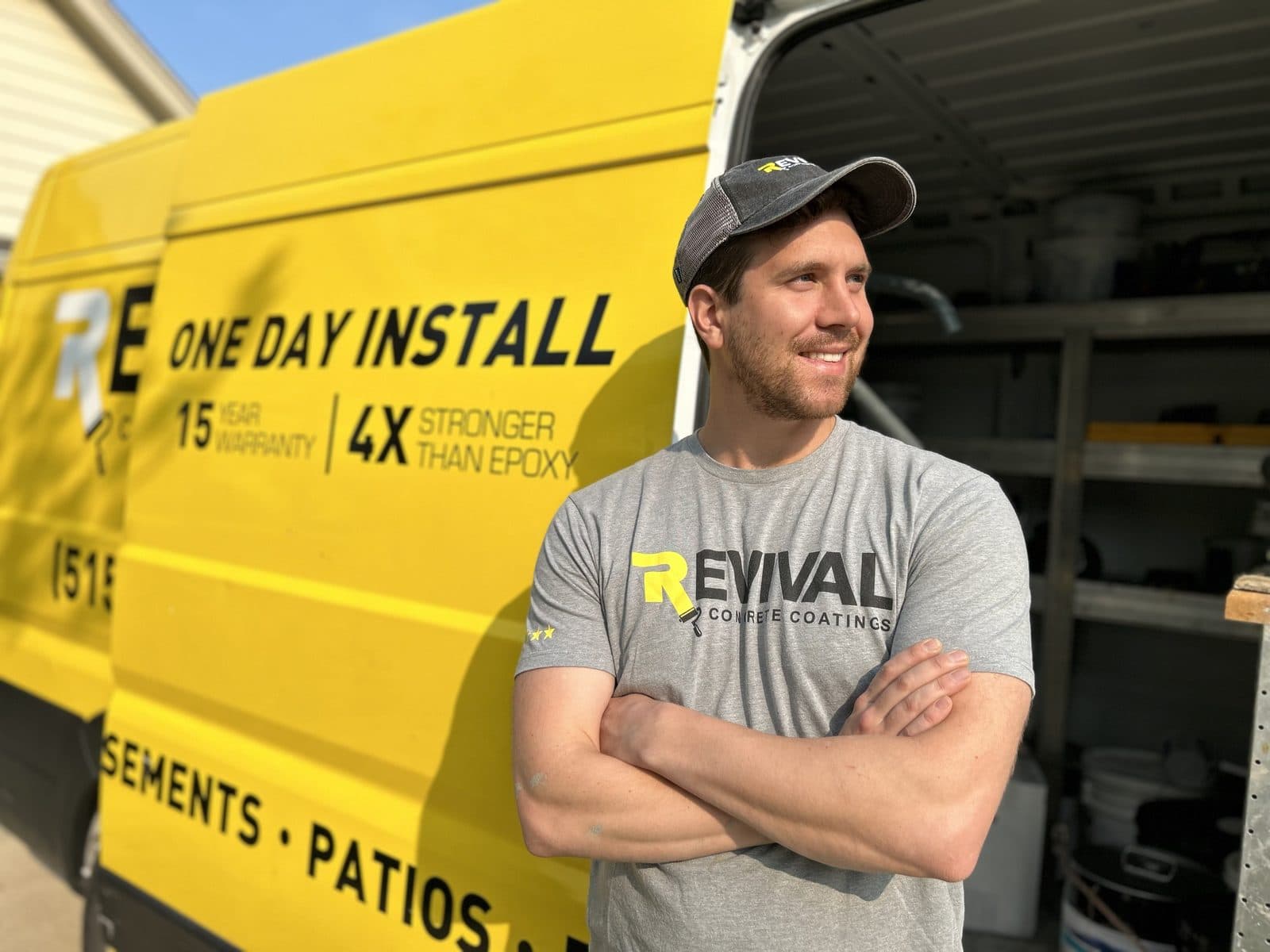 Jack Forsman, founder of PolySurface Marketing, in front of a Revival Concrete Coatings van